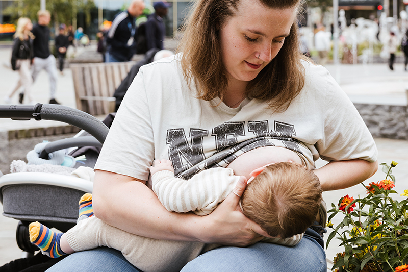 A woman breastfeeding a baby